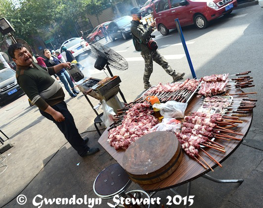 Cooking the Meat Al Fresco, Urumqi, Xinjiang, China, Photographed by Gwendolyn Stewart, c. 2015; All Rights Reserved